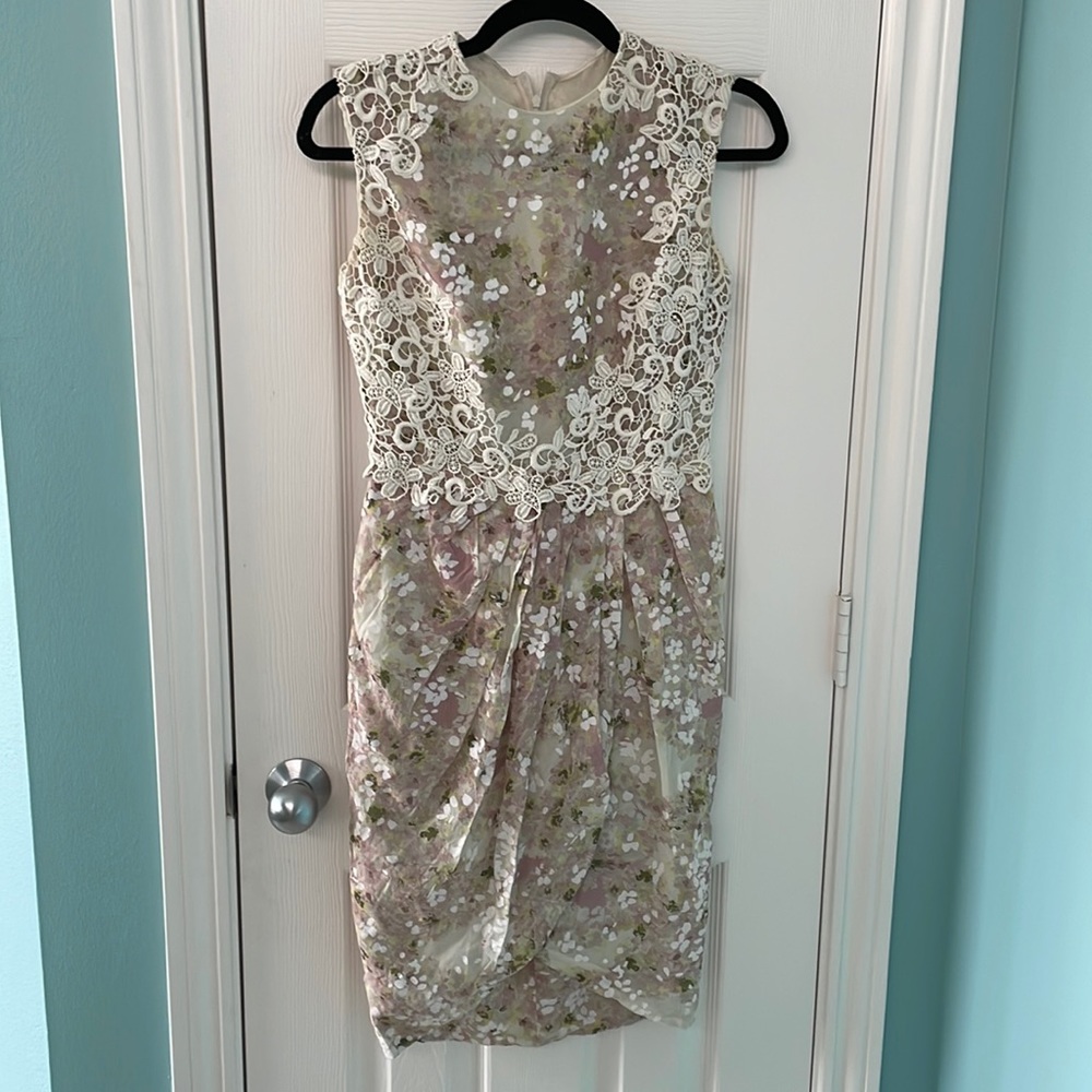 Giambattista silk and lace floral dress with pleats and bodice embellishments.